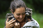 woman with young raccoons