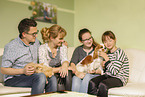 family with Siberian Cat and Cavalier King Charles Spaniel