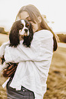 young woman with Cavalier King Charles Spaniel