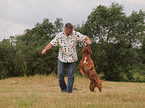 man playing with Bordeauxdog