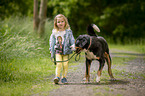 young girl with Greater Swiss Mountain Dog