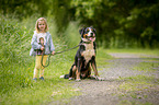 young girl with Greater Swiss Mountain Dog
