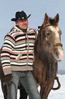 man and American Paint Horse