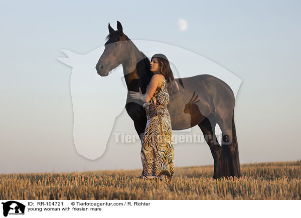 young woman with friesian mare / RR-104721