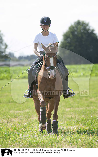 young woman rides German Riding Pony / NS-06293