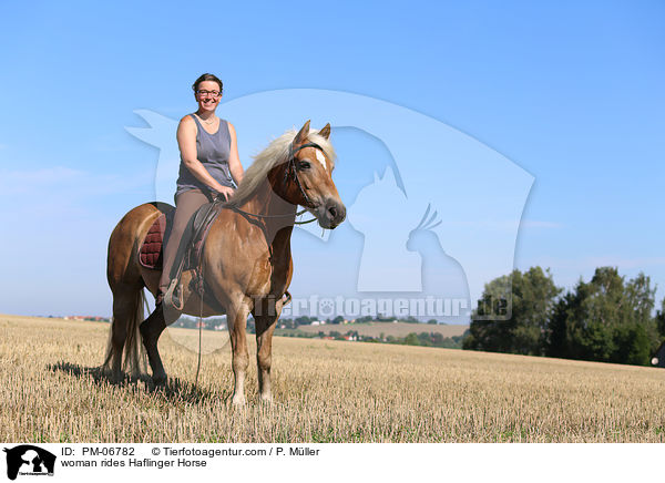 woman rides Haflinger Horse / PM-06782