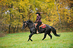 woman rides Quarter Horse