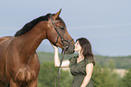 woman and Westphalian horse