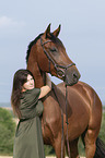 woman and Westphalian horse