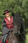 young woman with Friesian Horse
