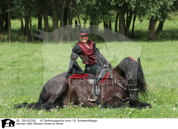 woman with friesian horse at show / SS-02762