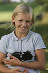 girl with Abyssinian guinea pig