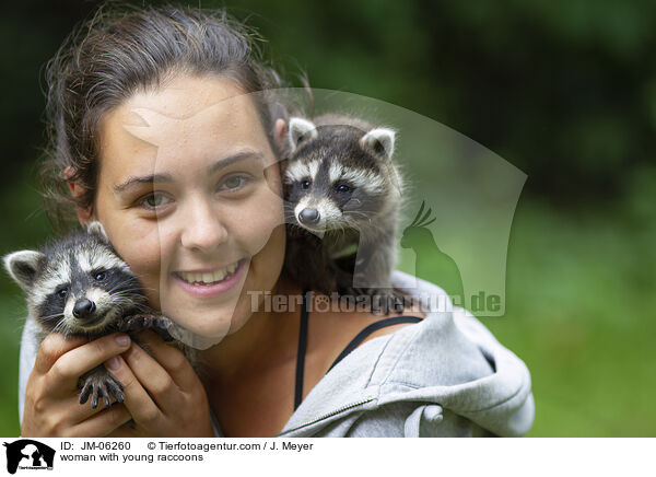 woman with young raccoons / JM-06260