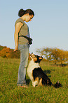 young woman with Australian Shepherd
