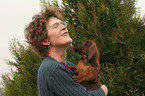 woman with Bavarian Mountain Hound puppy