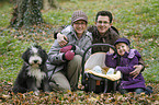 family with Bearded Collie