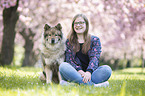 woman with Eurasian Dog