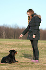girl and young Great Swiss Mountain Dog