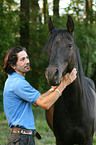 man and arabian horse