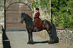Friesian horse with horsewoman