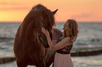 woman and Friesian horse
