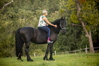 woman with Friesian Horse