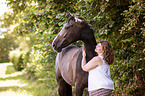 woman and German Riding Horse