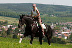 woman rides Hanoverian
