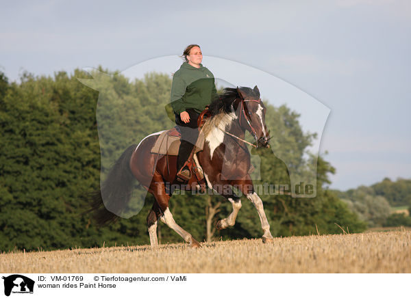 woman rides Paint Horse / VM-01769