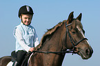 girl rides pony stallion