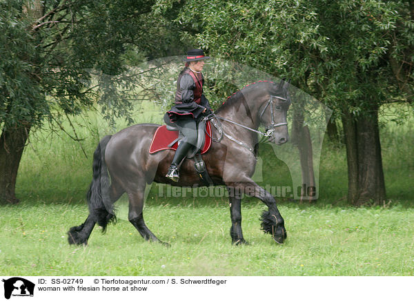 woman with friesian horse at show / SS-02749