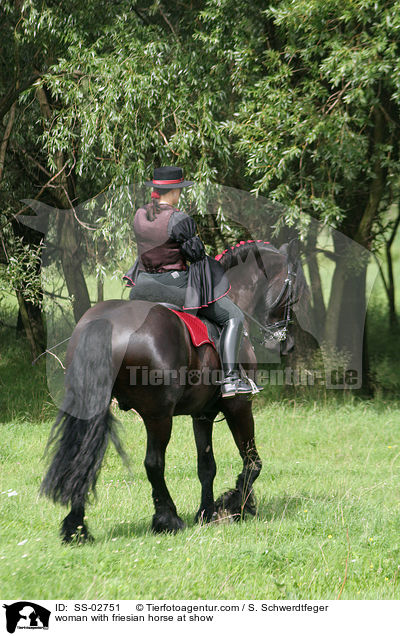 woman with friesian horse at show / SS-02751