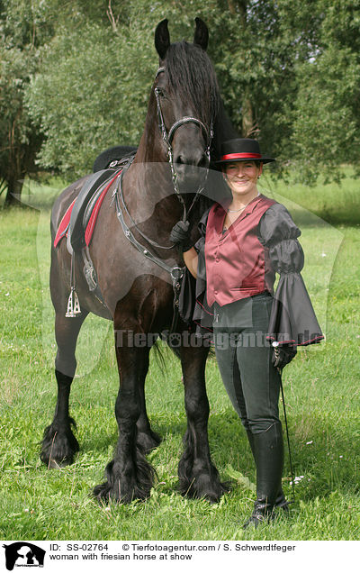woman with friesian horse at show / SS-02764