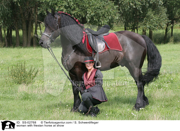 woman with friesian horse at show / SS-02768
