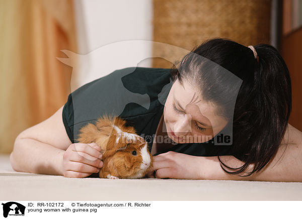 young woman with guinea pig / RR-102172