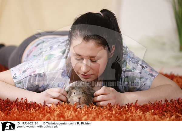 young woman with guinea pig / RR-102191