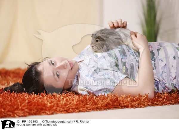 young woman with guinea pig / RR-102193