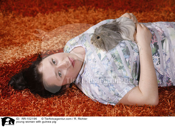 young woman with guinea pig / RR-102196